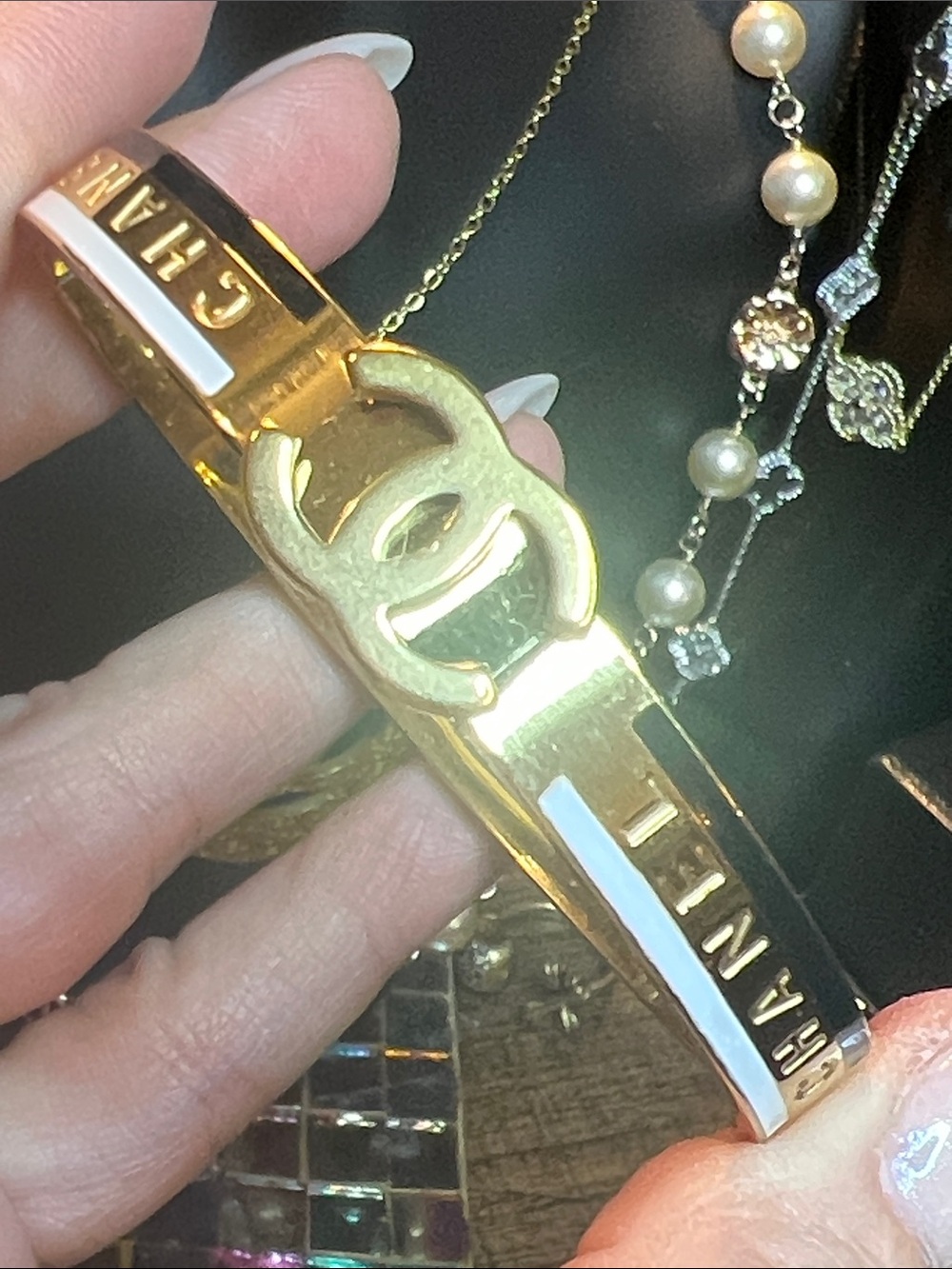 Elegant Gold-Tone Bracelet with White Enamel and Logo Accent
